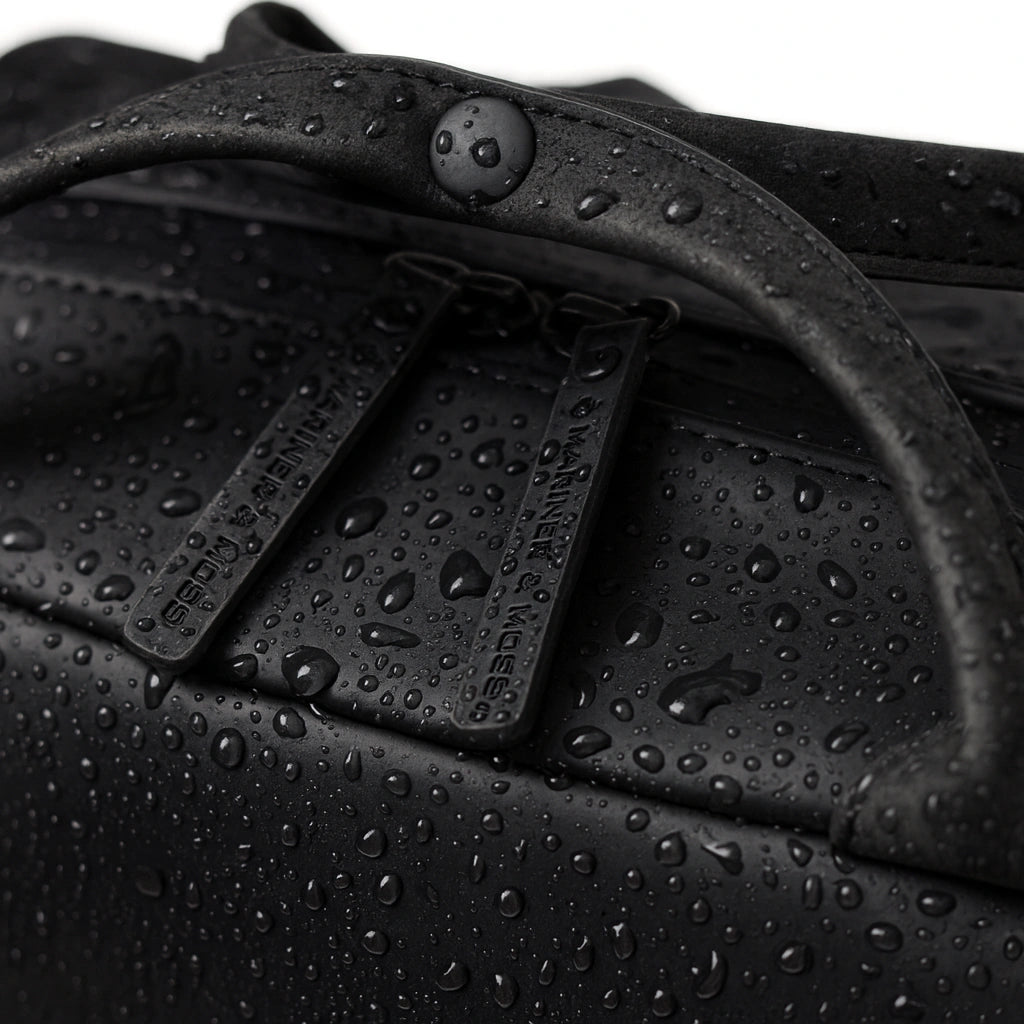 Black bag with water droplets on a close-up shot